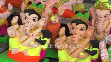 Multycoloured god Ganesha idols are ready to sell on the street of Delhi before Ganesh Chaturthi