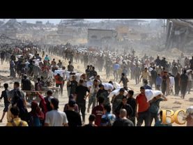 Officials say 85 Palestinians seeking aid are killed in Gaza