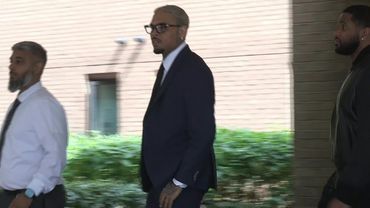 US singer Chris Brown leaves court after pleading not guilty to assault charge | AFP