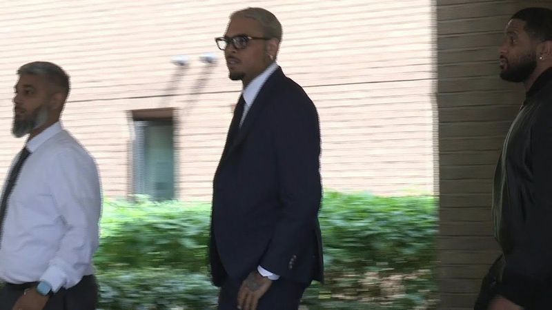 US singer Chris Brown leaves court after pleading not guilty to assault charge | AFP