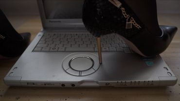 Heels crush the laptop
