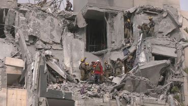 Israel rescuers search rubble of building hit by deadly Iranian strike | AFP