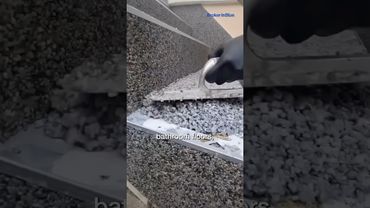 Builders are adding tiny stones to bathroom floors—and it’s genius.