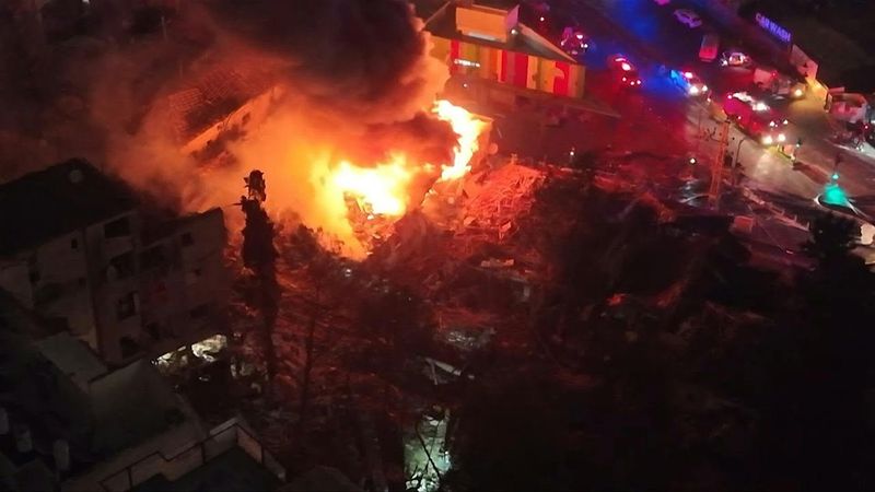 AERIAL: Fire blazes as responders deployed at site of Iranian strike in central Israel | AFP