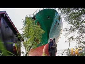 Massive cargo ship runs aground just feet from Norwegian man’s home