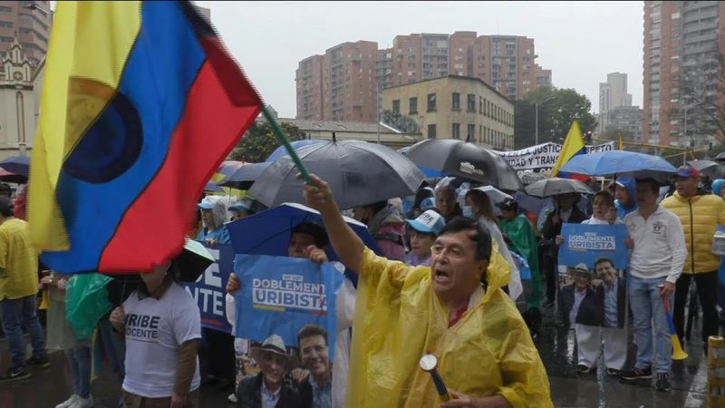 Supporters of Colombian ex-president Uribe march following sentence | AFP