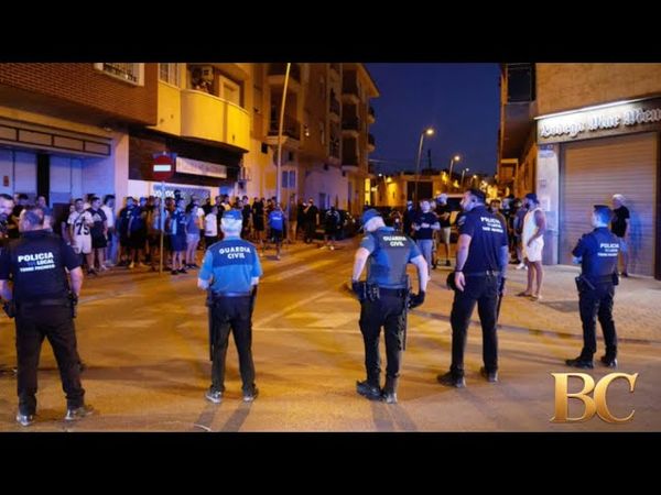 Police detain 8 people after anti-migrant clashes in Spanish town