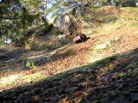 RC Hilux crawling gravel hill