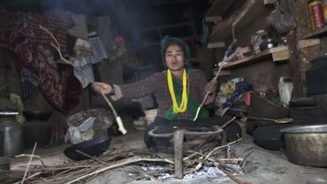 The art of firewood cooking in village . Old is gold