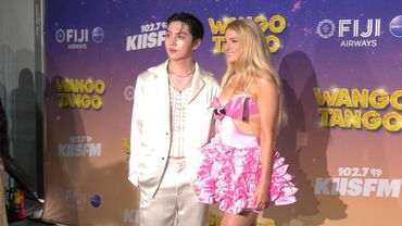KINO and Meghan Trainor pose together at iHeartRadio's 102.7 KIIS FM. Wango Tango 2025 green carpet