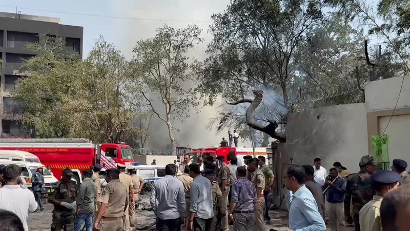 Firefighters and security personnel at Air India crash site | AFP