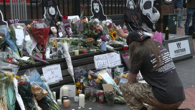 Ozzy Osbourne fans lay flowers on 'Black Sabbath Bridge' in Birmingham | AFP