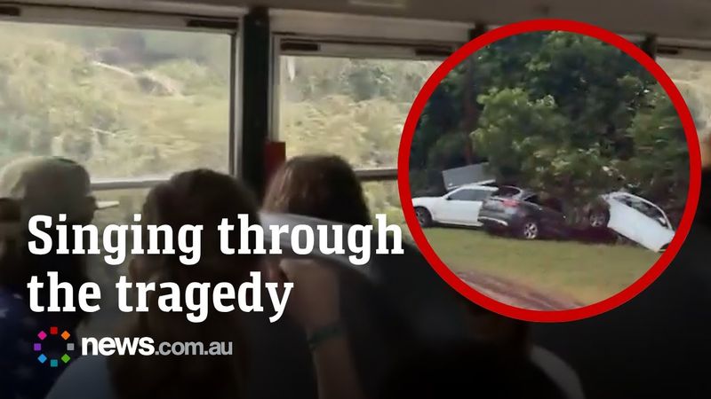 Child survivors of Camp Mystic flood sing on bus during evacuation.