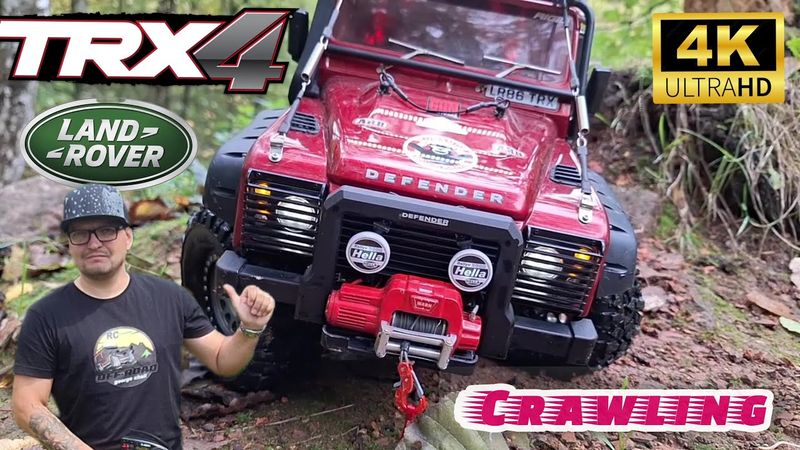 RC Traxxas TRX 4 defender in 1/10 scale crawling by the lake