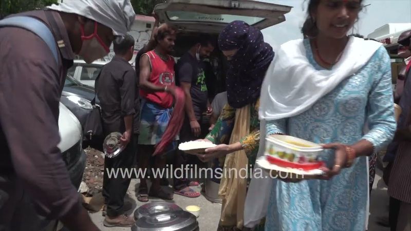 Garib Kalyan Seva Trust giving out free food to the poor near AIIMS Hospital New Delhi