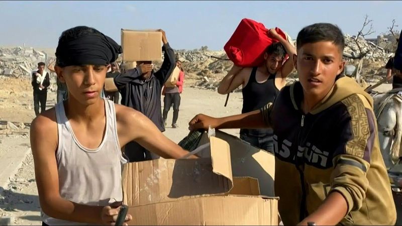 Thousands rush into new aid distribution centre in south Gaza | AFP