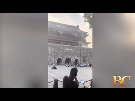 Tourists flee as roof collapses off 650-year-old building in China