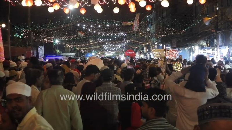 People are wearing Kurta Pyjama with a round cap, the Market near Jama Masjid, Old Delhi