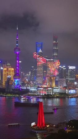 🐉🌟 Witness the magical Lujiazui Light Show, where dragons soar above ...