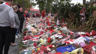 People lay flowers for Diogo Jota outside Liverpool's Anfield stadium | AFP