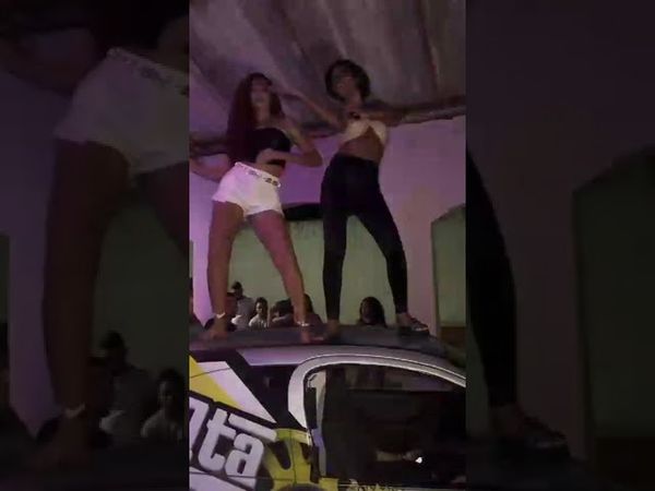 two girls on car