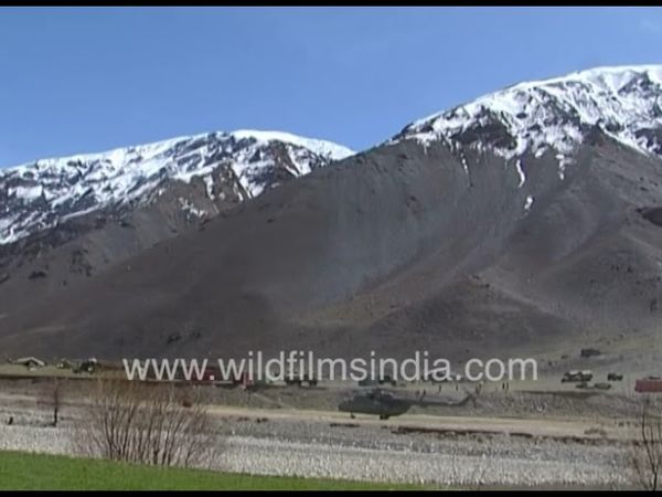 Russian Mi8 Helicopters land at an active airfield in Afganistan, during the previous Taliban rule