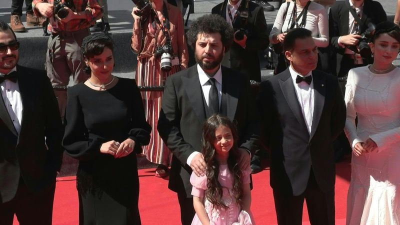 Cast of Iranian film 'Woman and Child' walk Cannes red carpet | AFP