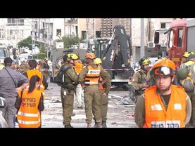 Emergency teams clear rubble at site of Iranian strike near Tel Aviv | AFP