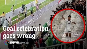 Soccer player takes three metre plunge during goal celebration