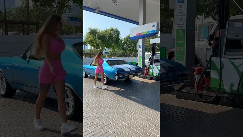 Girl and Chevrolet chevelle SS on gas station in Dubai