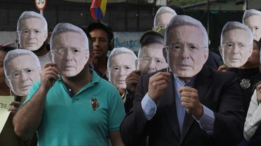 Supporters of Colombian ex-president outside court ahead of witness tampering case verdict | AFP