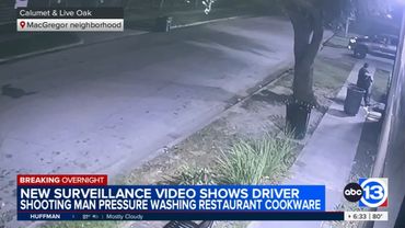 Man pressure washing outside of restaurant shot by driver, video shows