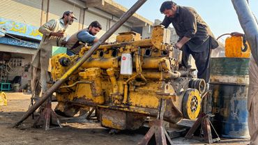 Hardworking mechanic repairing a heavy Komatsu engine / Amazing Restoration