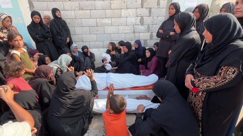 Gazans mourn loved ones including infant killed in airstrike on Khan Yunis | AFP