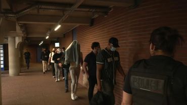 French police officers arrive in court for assault trial | AFP