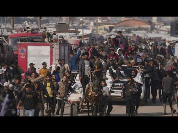 Dozens killed and scores injured in shooting near aid point in Gaza