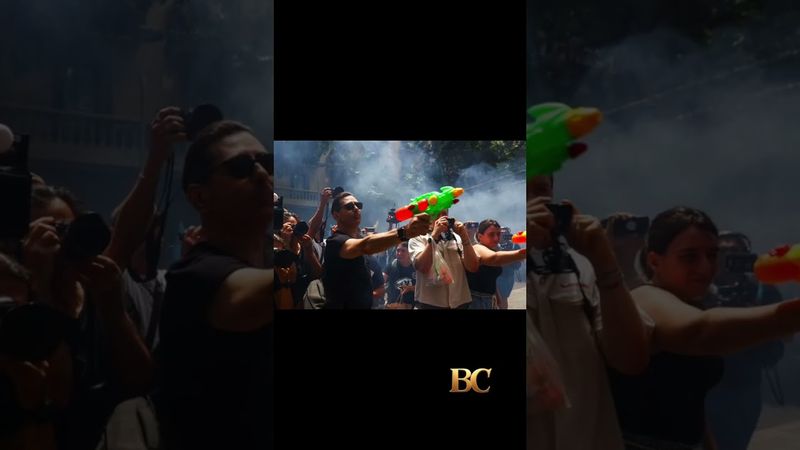 Protesters in Spain shoot water guns at tourists