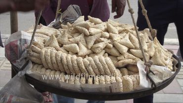 Hawker roams the streets of Delhi, and selling sweets near Safdarjung Hospital