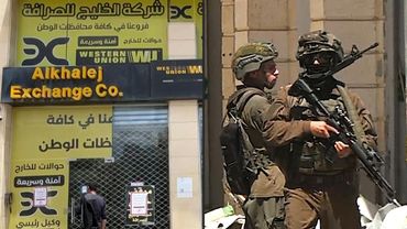 Israeli forces raid foreign exchange store in Ramallah | AFP