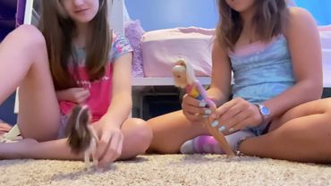 Playing with gymnastics Barbie’s.￼