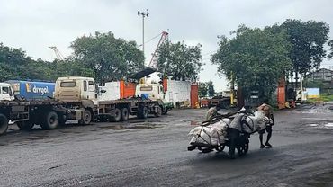 Trucks queue up at Mumbai port as US tariffs set to kick in | AFP