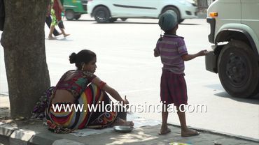 Poor family living on streets of Delhi city: India's poverty goes hand in hand with extreme wealth
