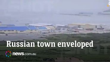 Buildings surrounded by water after tsunami warning issued