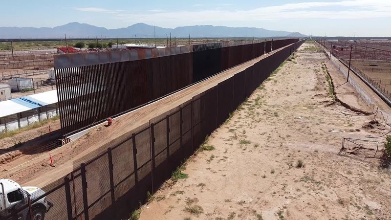 Part of US-Mexico border wall painted in black at Trump's request | AFP