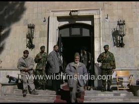 Government Officers and armed gunmen pose at Presidential Palace Kabul: Bureaucracy in Afghanistan