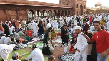 Muslim devotees are breaking their fast  during Eid at the Jama Masjid in Old Delhi