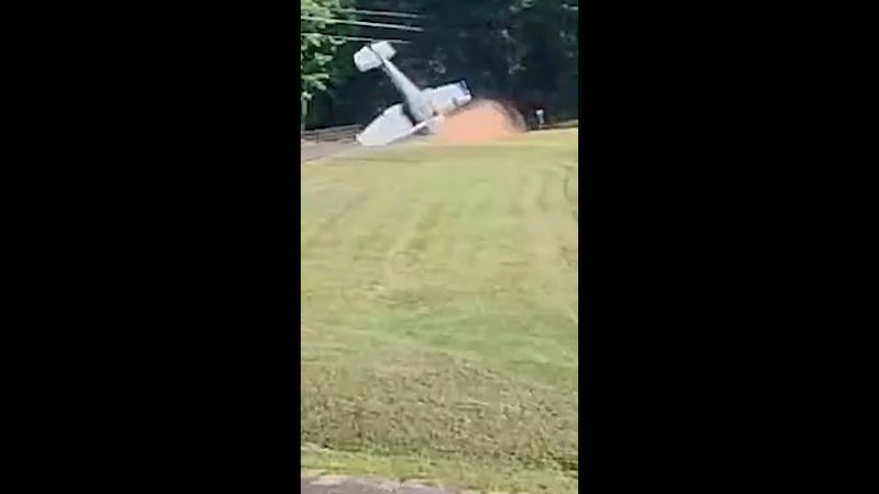 Small plane flips over after landing in suburban front yard