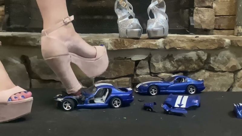 Two Dodge Vipers vs two pairs of Heels.