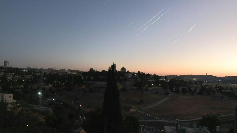 Smoke trails streak over Jerusalem as Iran fires more missiles | AFP