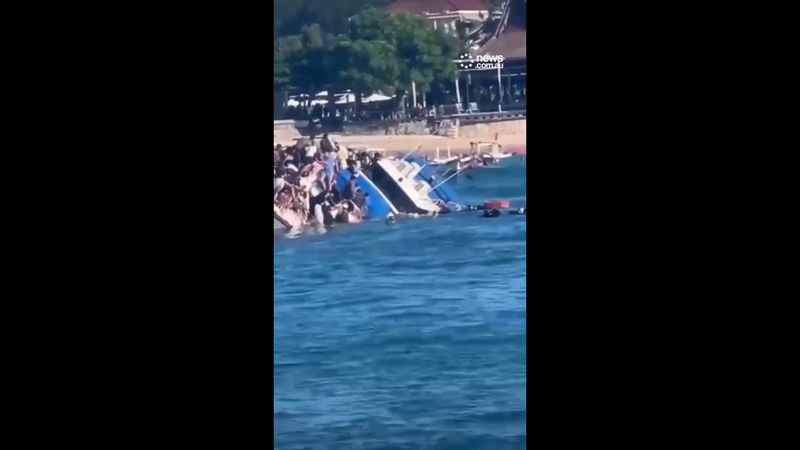 Terrifying moment ferry sinks